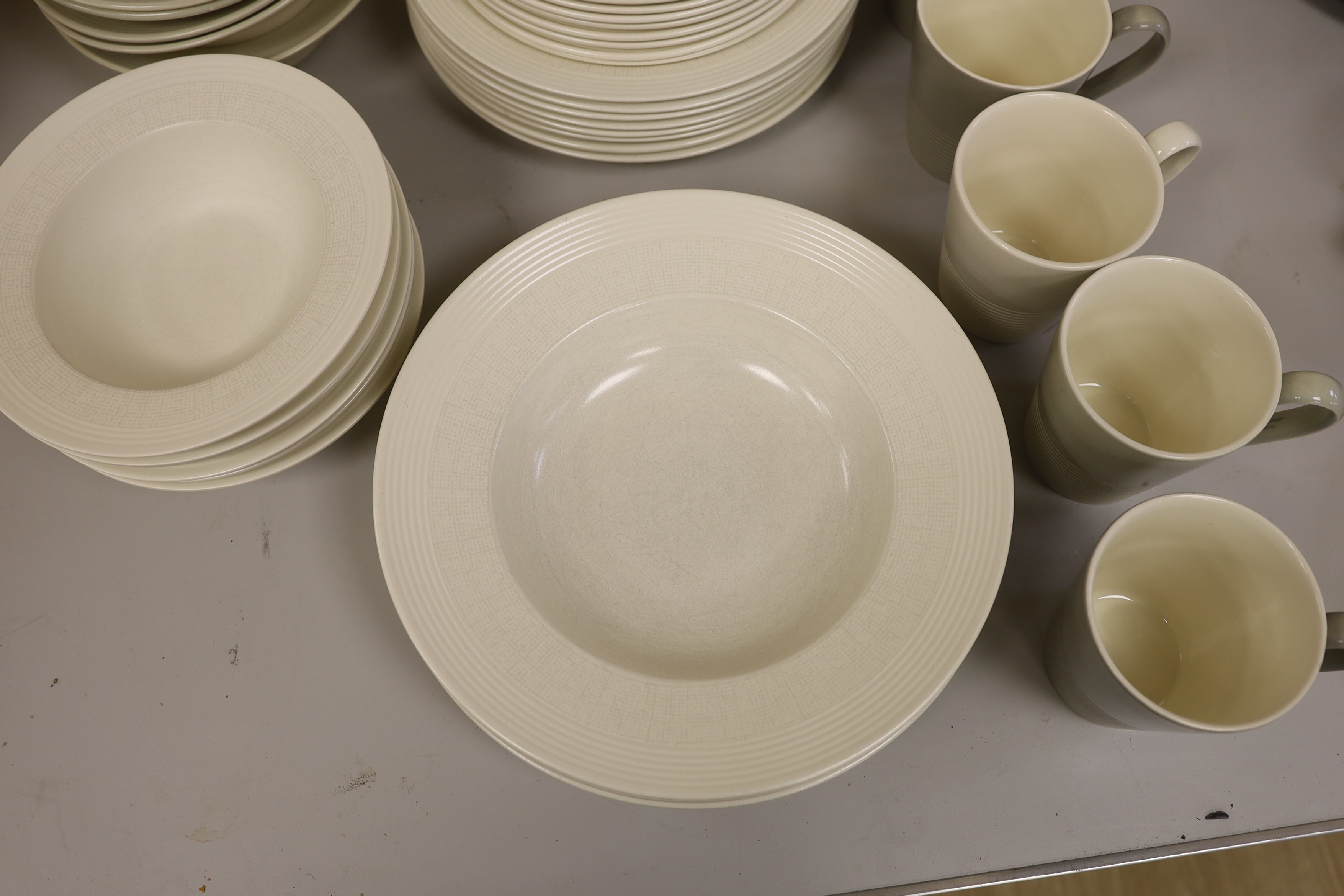 Paul Costelloe for Wedgwood, a part dinner set including six mugs, six bowls and eight dinner plates
